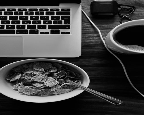 water and a simple lunch on a work desk